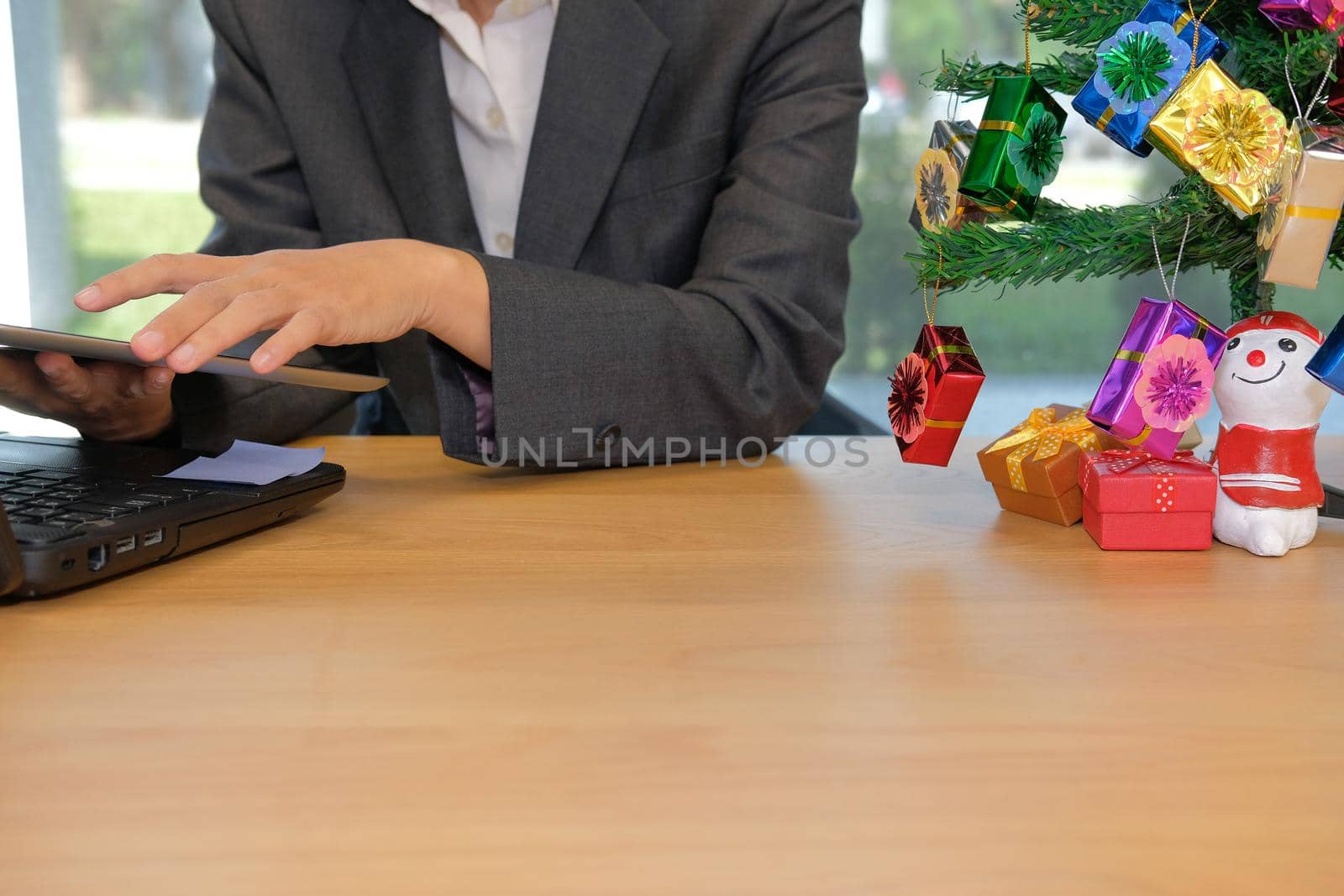 man businessman working with tablet during christmas new year holiday by pp99