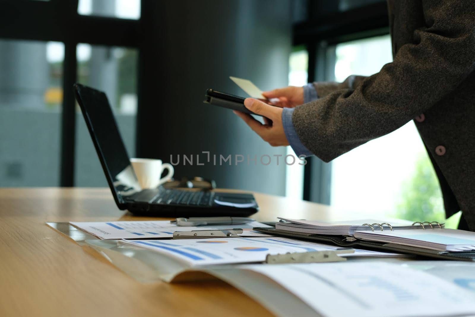 man holding credit card using smart phone for online shopping. businessman purchasing, paying on internet by pp99