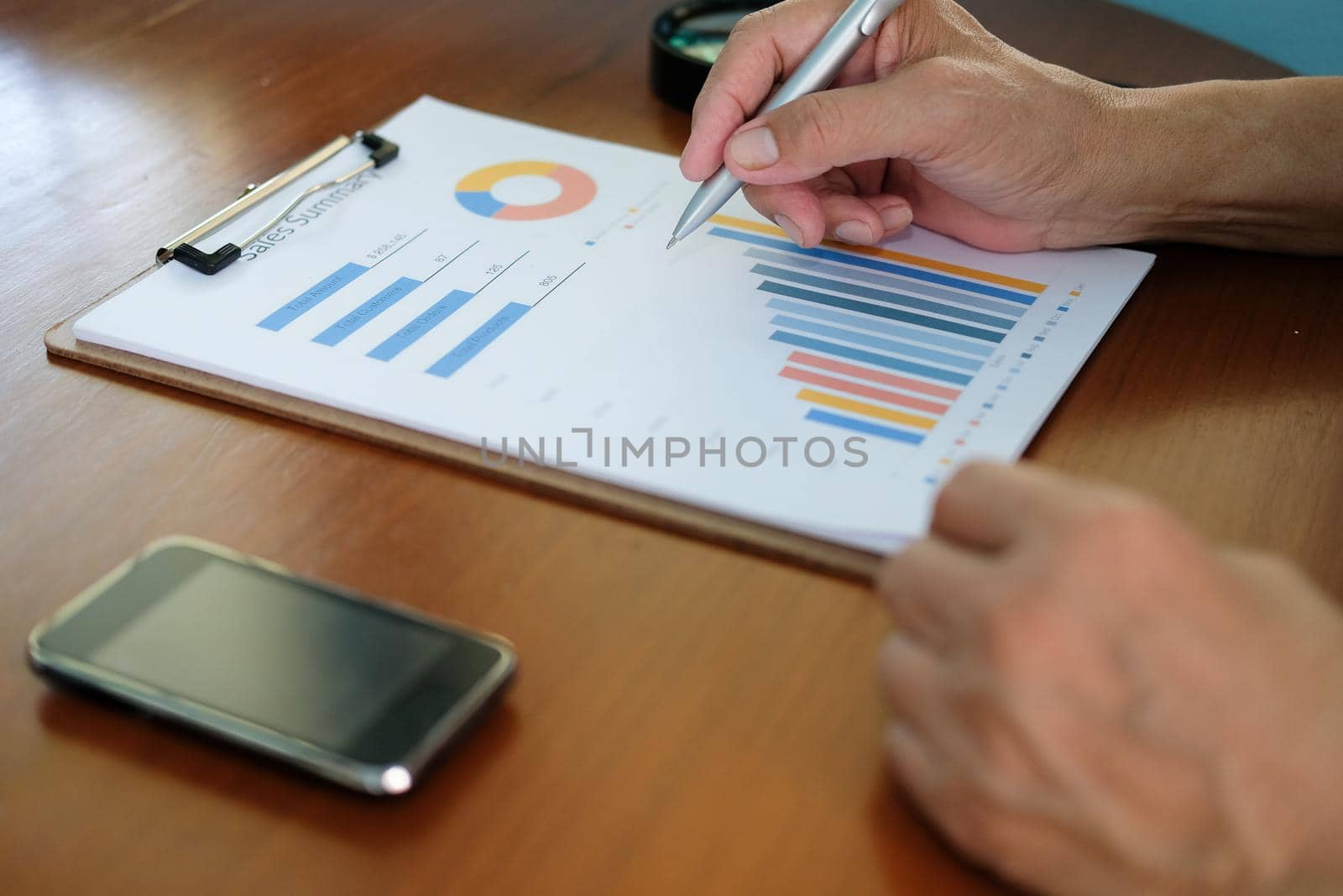 business adviser analyzing company financial report. professional investor reviewing sales data. businessman working on startup project by pp99