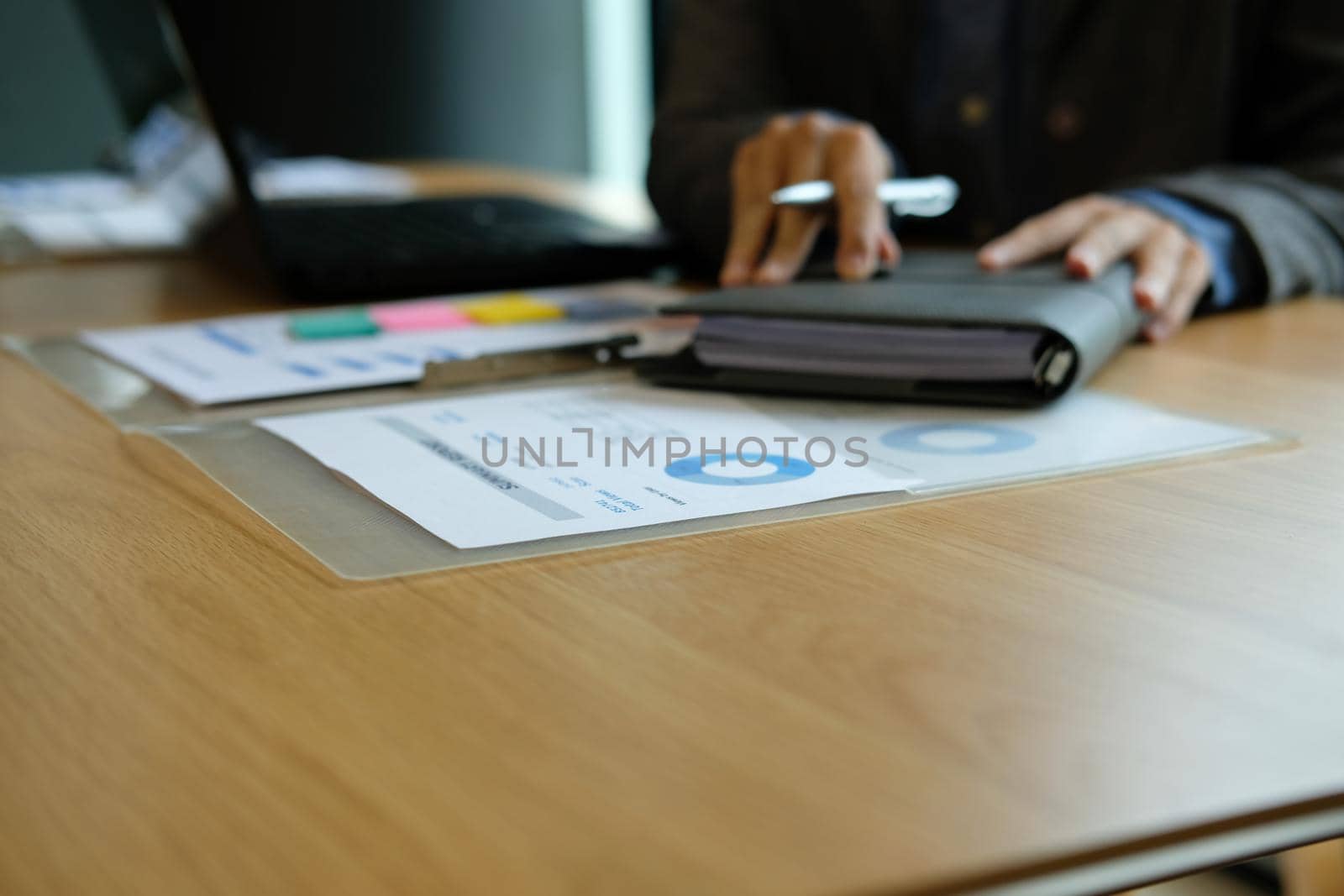 man organize plan with notebook. businessman working at workplace by pp99