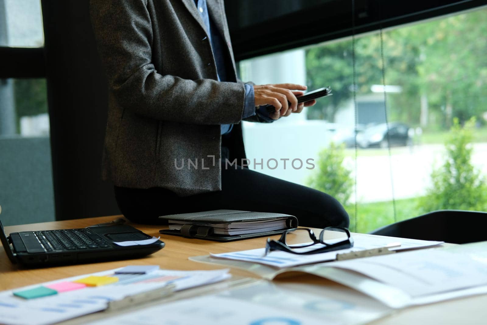 businessman using smart phone at workplace. startup man working at office. by pp99