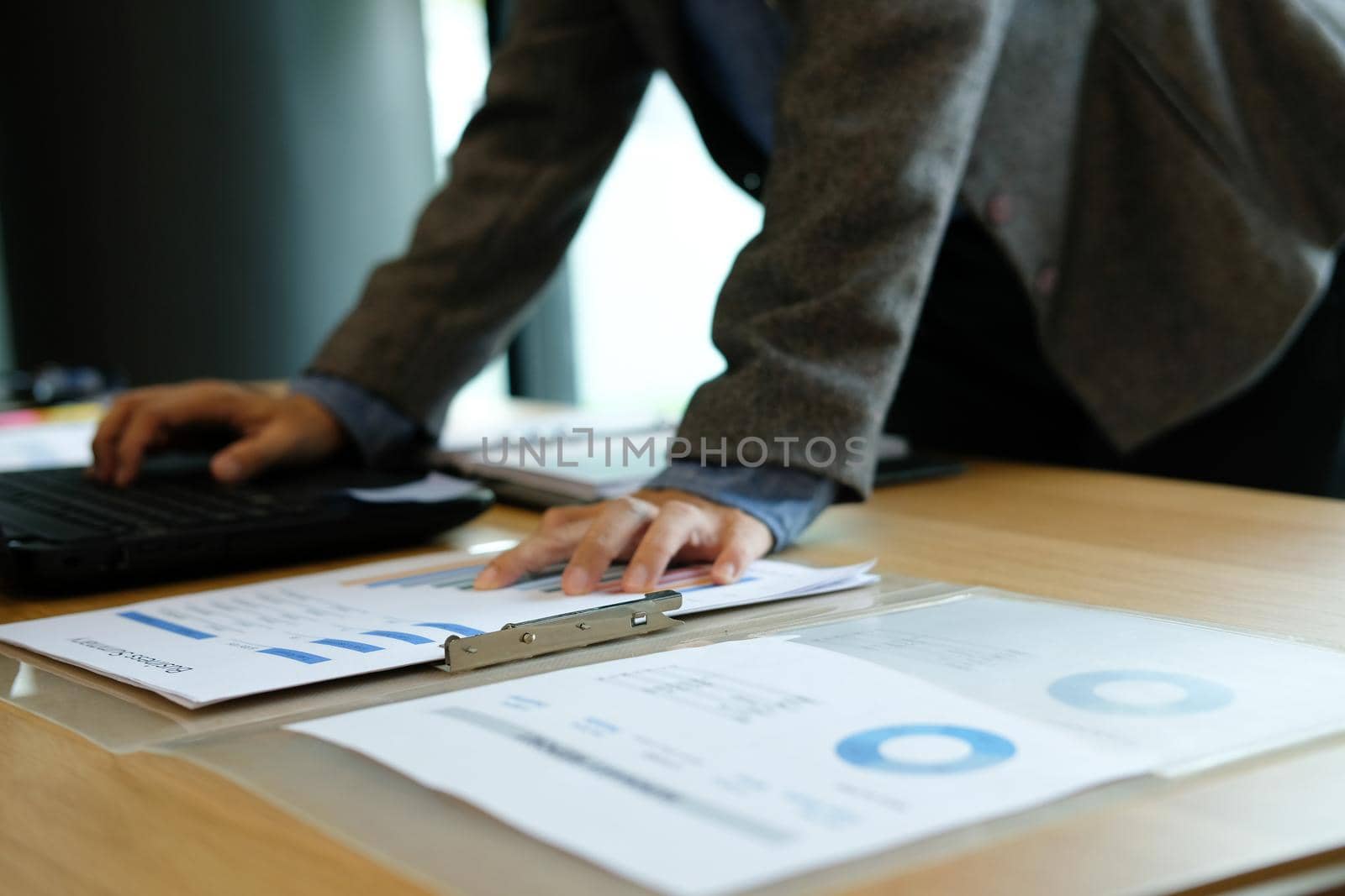man using computer. businessman working with financial graph chart diagram