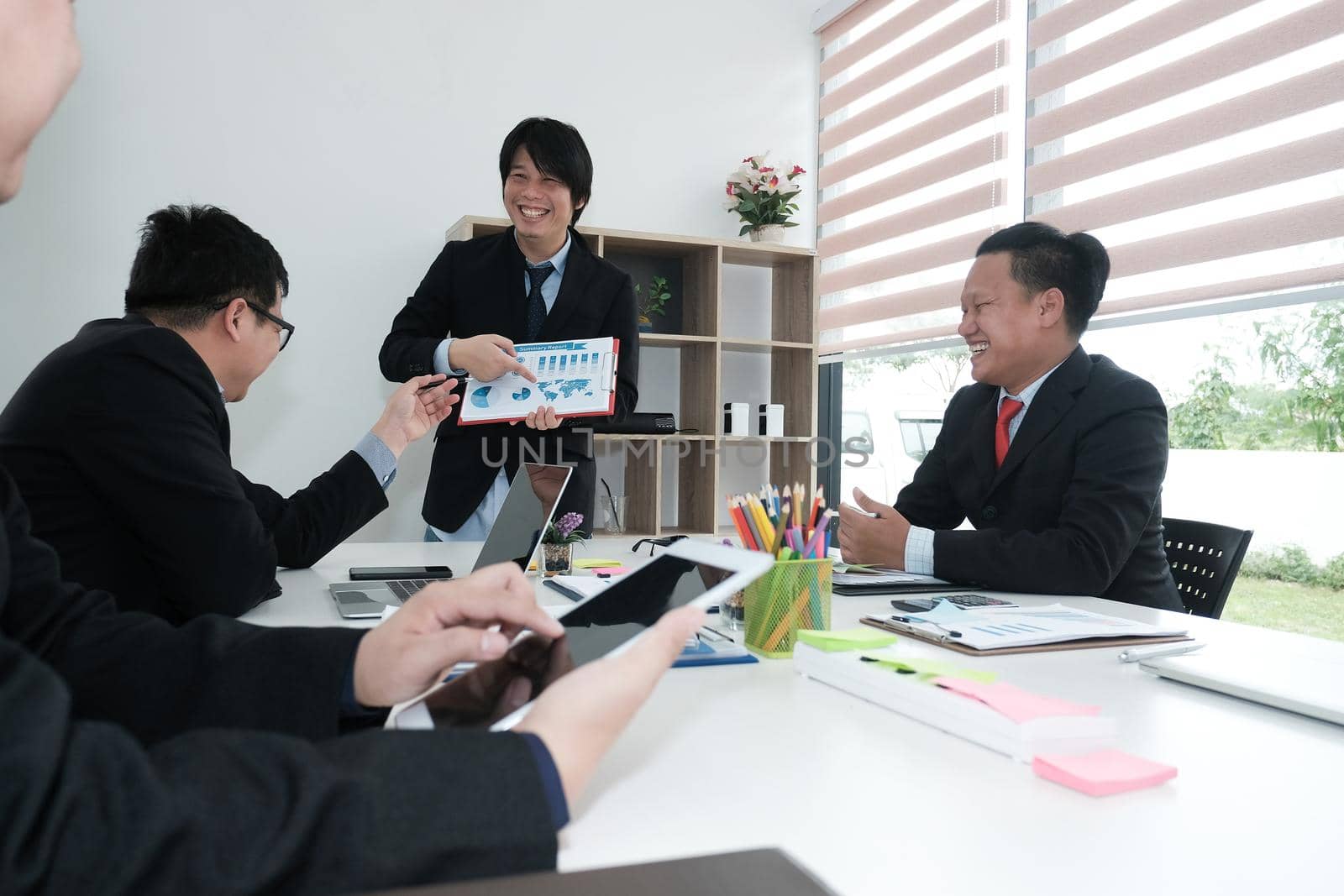 business people have meeting. businessman working with financial plan report. startup man discussing idea at workplace. teamwork, corporate concept. by pp99