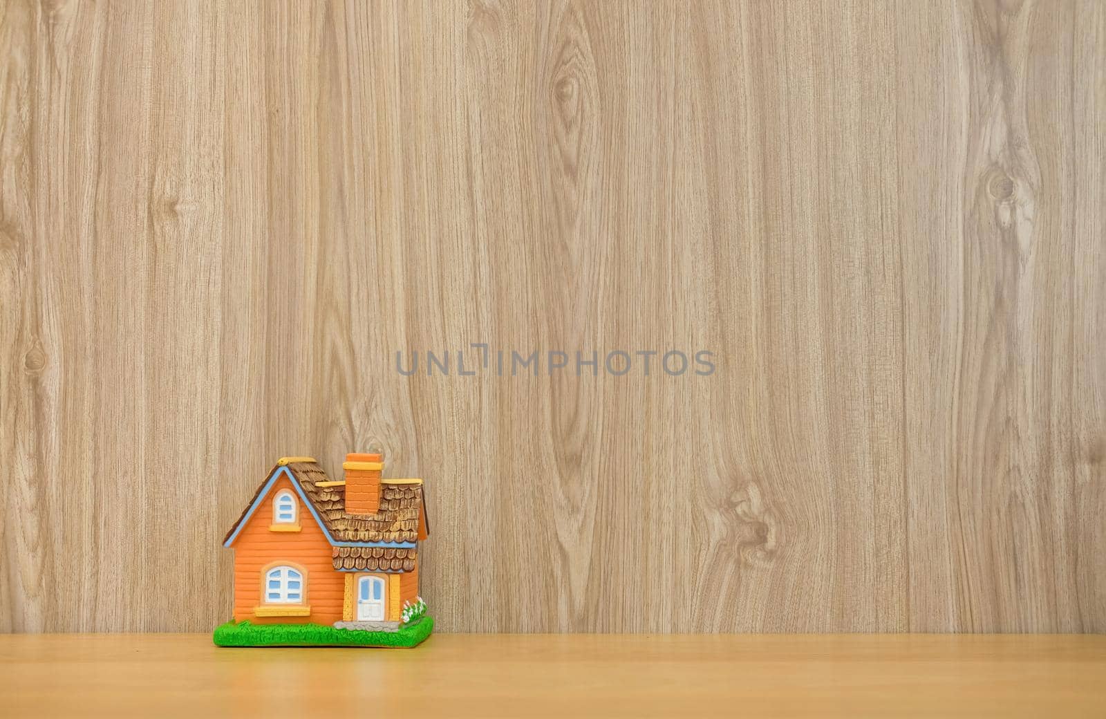 house model on wooden desk. realtor real estate agent workplace. buying selling renting property by pp99