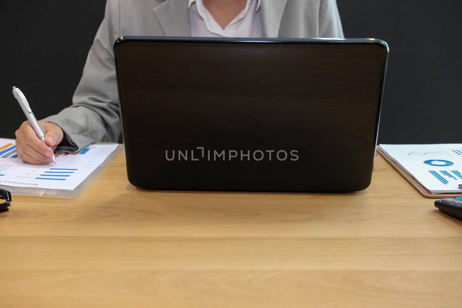 businessman using computer. startup man working with document at office. young male entrepreneur analyze financial data at workplace.