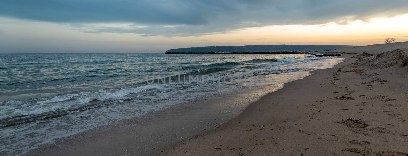 Idyllic panoramic view of coastline in the afternoon by EdVal