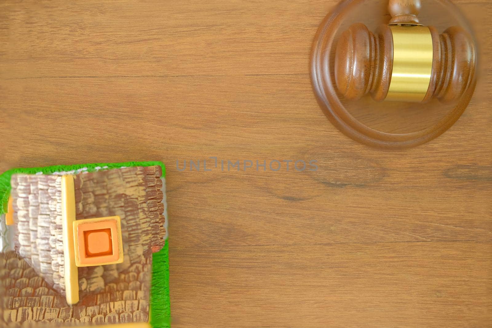 judge gavel & house model on wooden desk. real estate dispute & property auction concept by pp99
