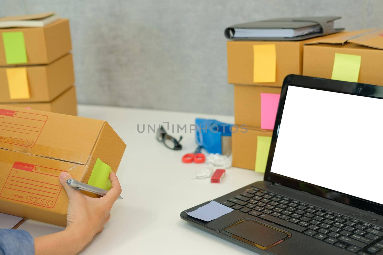 startup small business owner hold cardboard box at workplace. freelance woman entrepreneur seller prepare parcel box for delivery product to customer.  Online selling, e-commerce concept