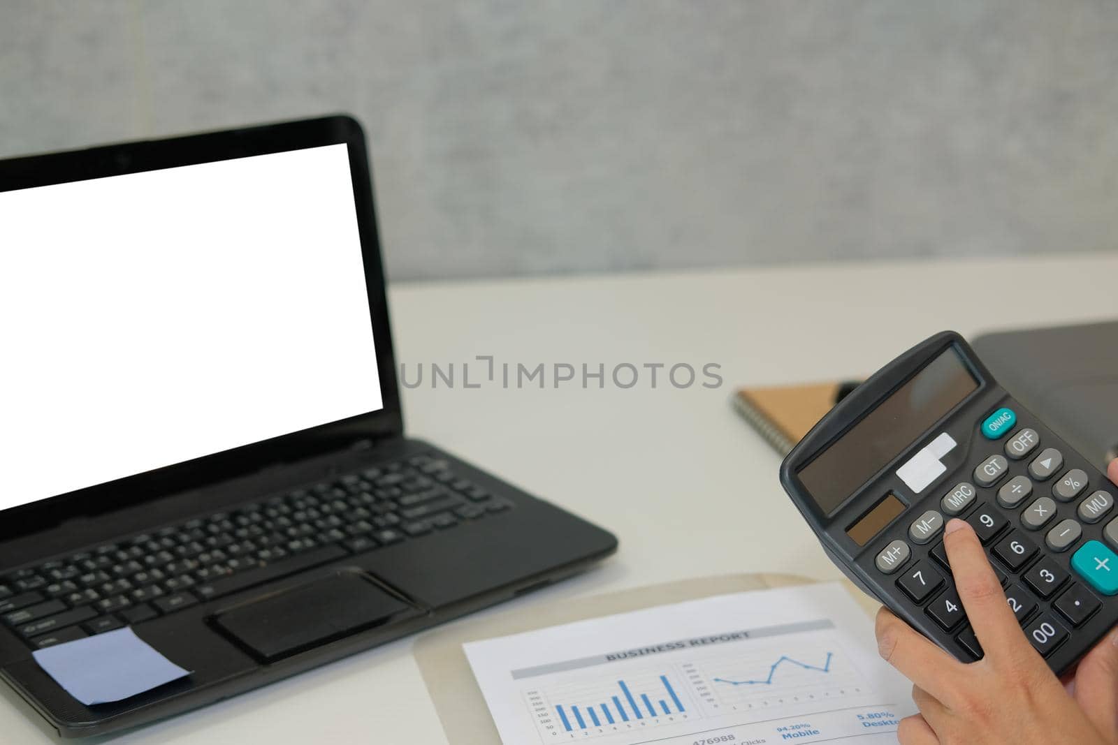 financial adviser working with calculator at office. accountant doing accounting & calculating revenue & budget. bookkeeper making calculation. finance & economy concept