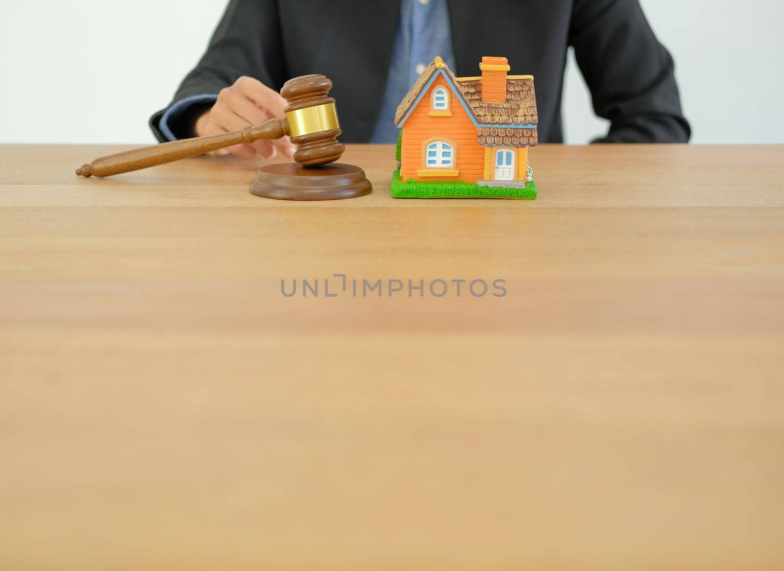 businessman lawyer with judge gavel & house model. buying selling renting real estate property by pp99