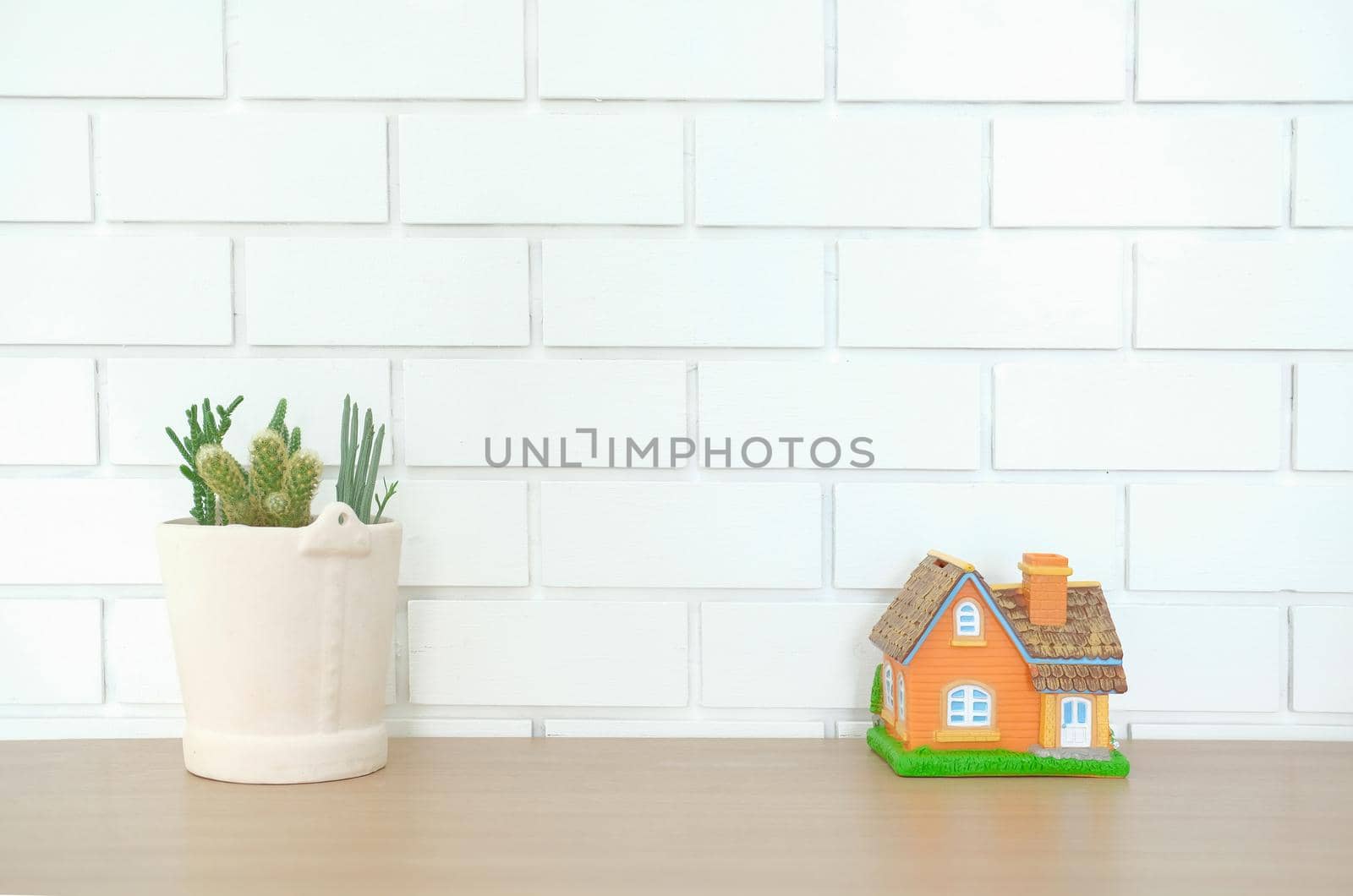 house model on wooden desk. realtor real estate agent workplace. buying selling renting property by pp99