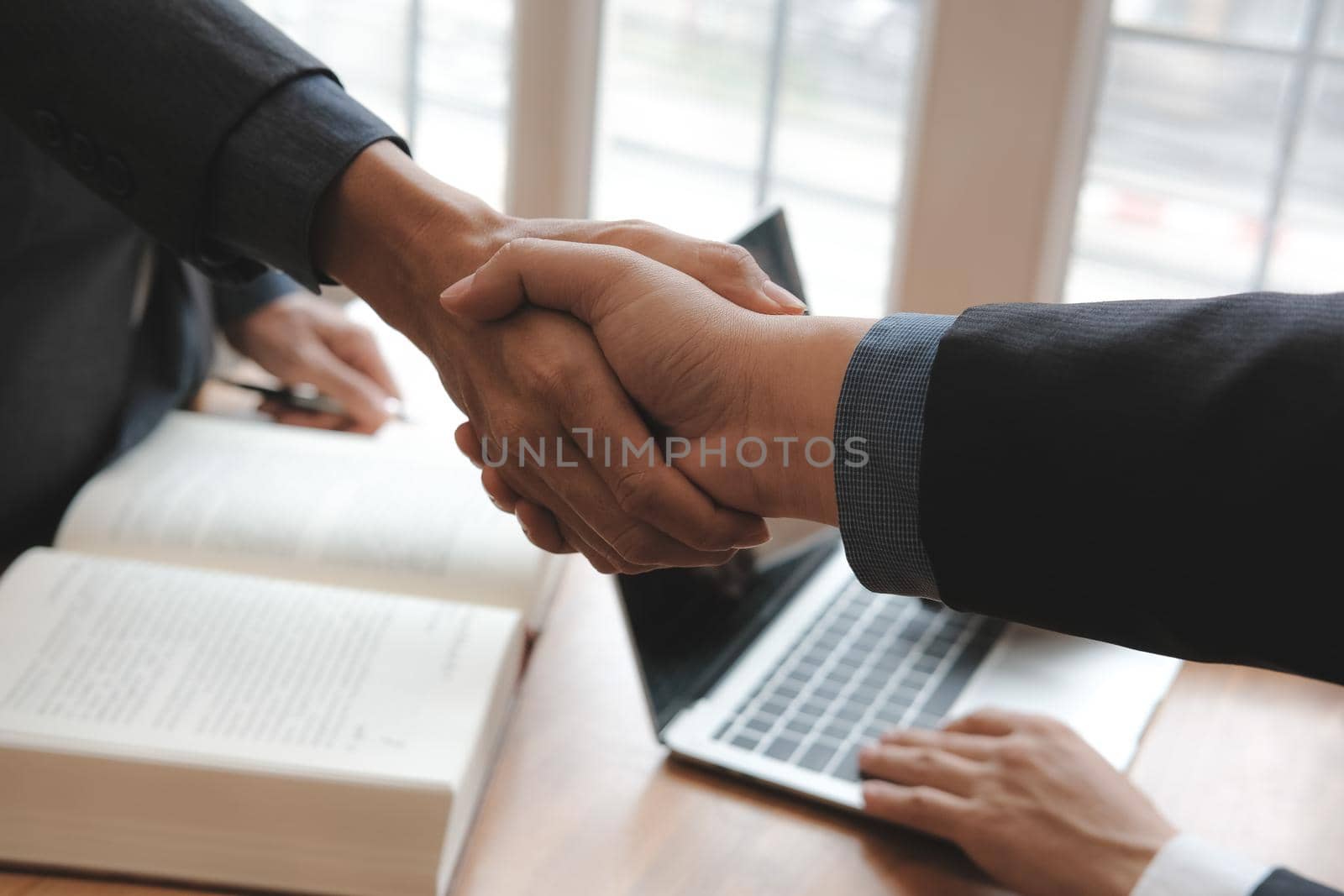 Business people shaking hands after meeting. colleagues handshaking after conference. Greeting deal, teamwork, partnership, cooperate concept.