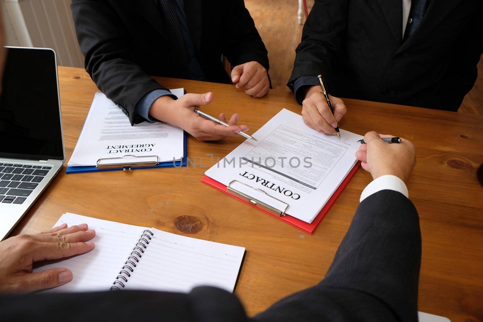 businessman consulting lawyer & signing contract agreement. team meeting at law firm