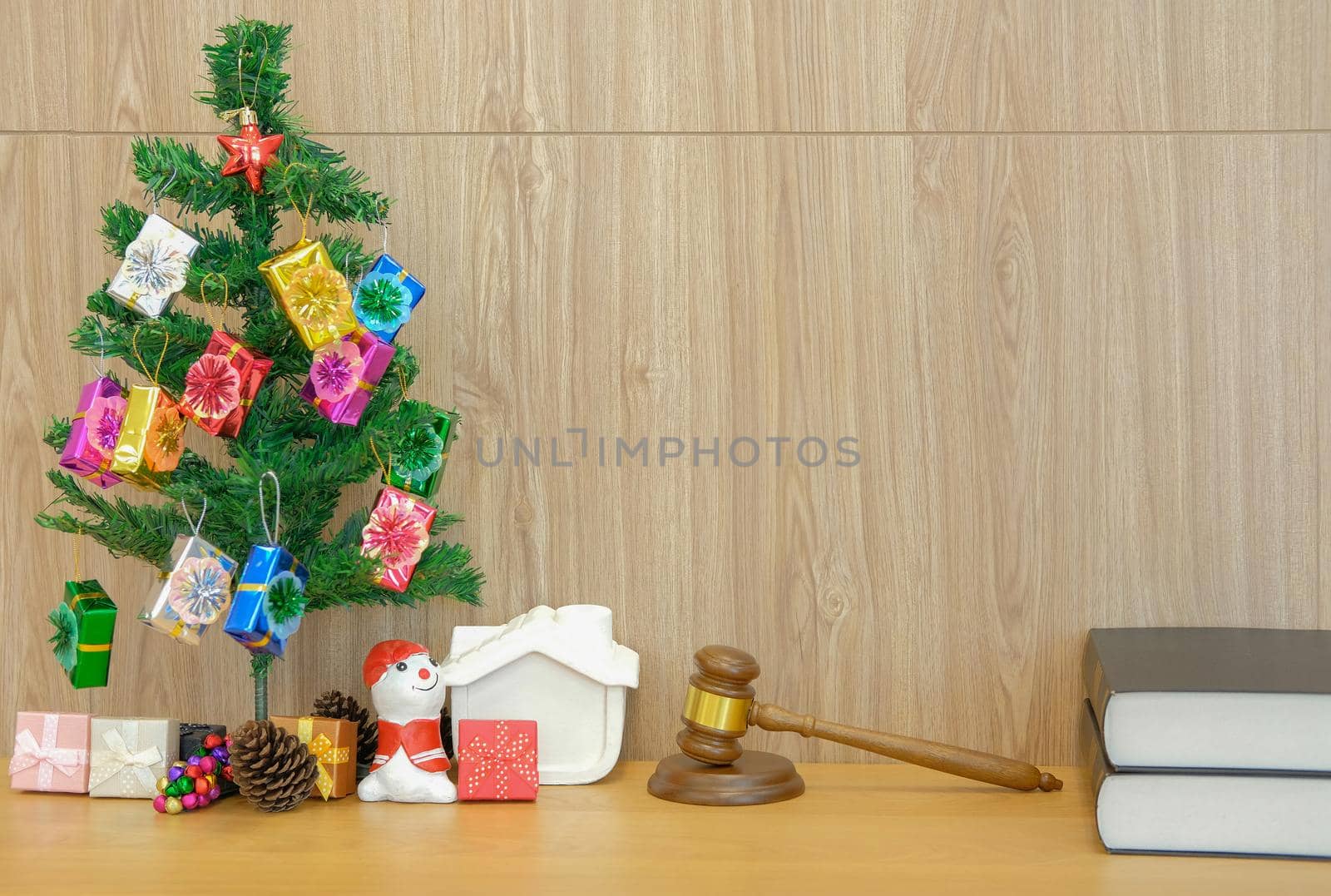 decorated christmas tree judge gavel & law book. lawyer attorney justice workplace at xmas new year holiday festival.