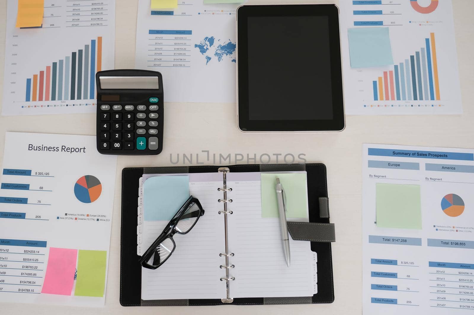 eyeglasses, calculator, financial document at office workplace. business concept