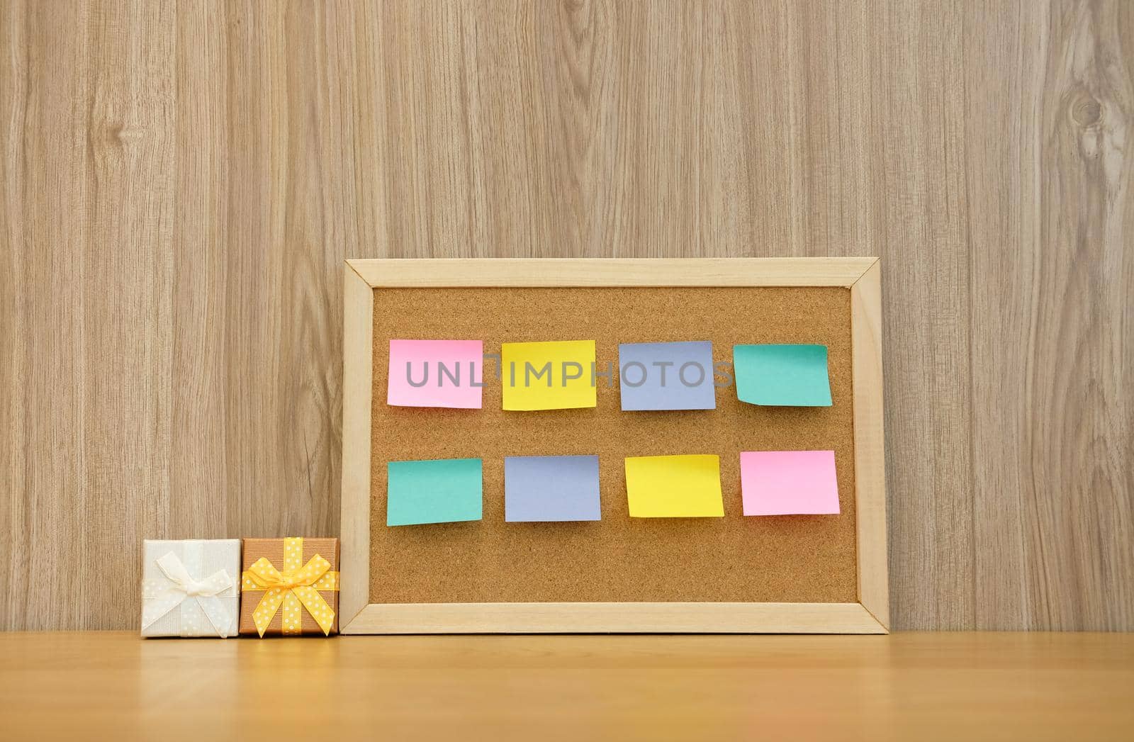 sticky notes reminder on cork board & gift box. bulletin corkboard