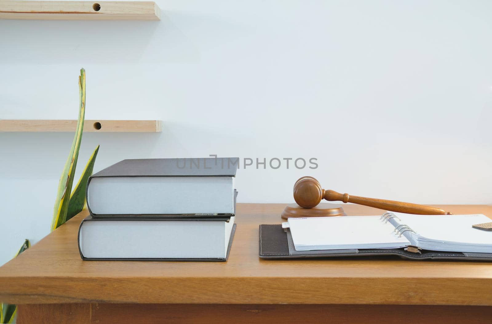 legal law book judge gavel & notebook at courtroom. lawyer attorney justice workplace