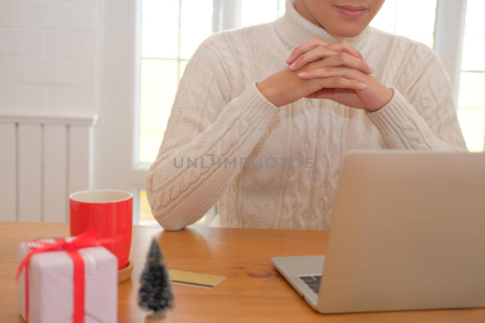 man using computer at home during xmas. christmas holiday new year celebration season greetings.