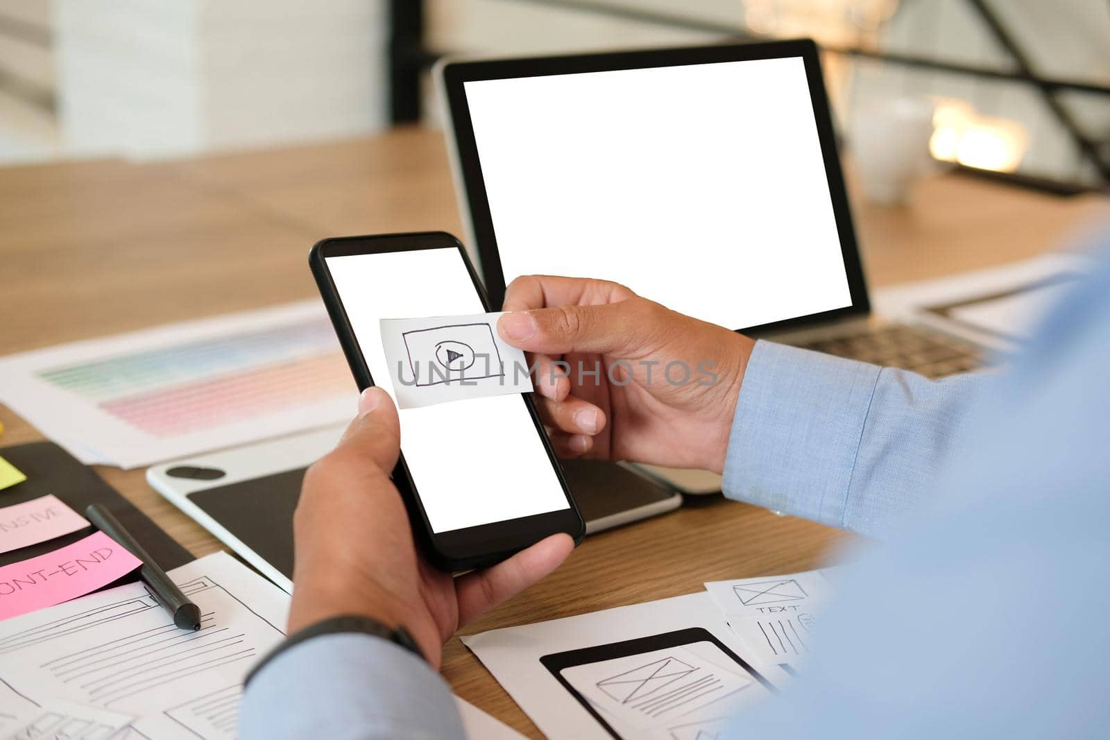 user experience UX designer designing web on smart phone layout. UI planning mobile application. developer work with business prototype