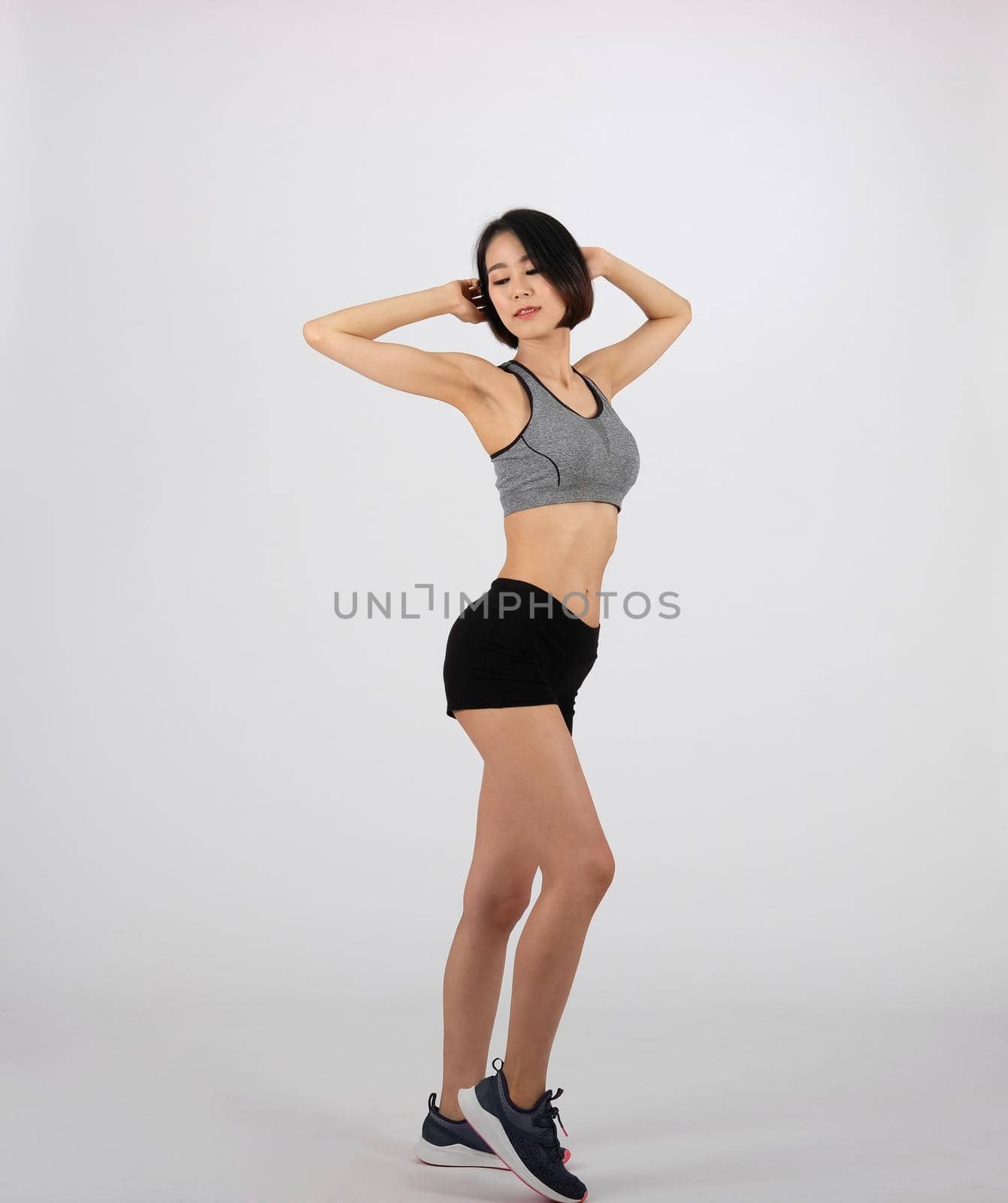 sporty fitness woman in sportswear on white background. healthy sport lifestyle