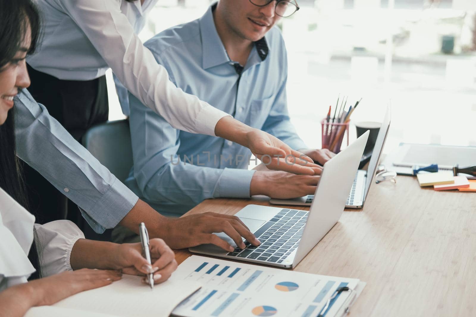 business people discussing on performance revenue in meeting. businessman working with co-worker team. financial adviser analyzing data with investor.