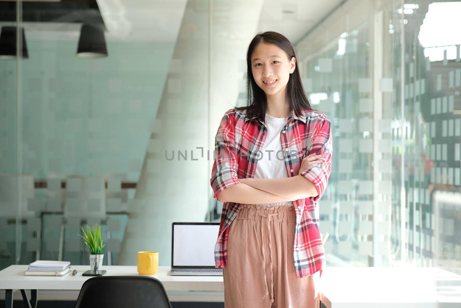 asian teenage girl teenager posing at co-working space