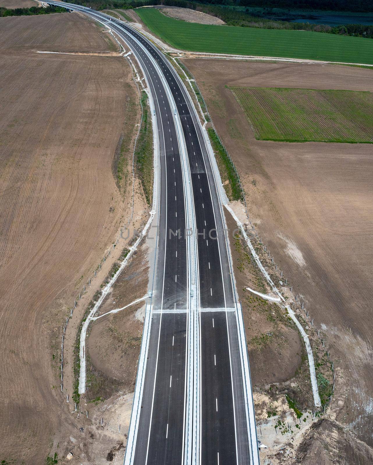 Aerial view from a drone of a new highway. Transportation and infrastructure concept