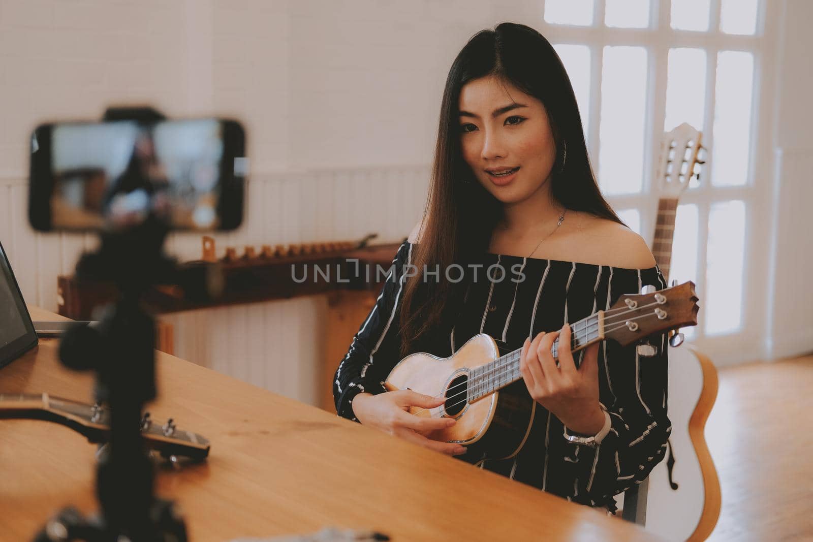 blogger live broadcasting music instrument tutorial on social media. vlogger recording online vlog video. influencer marketing