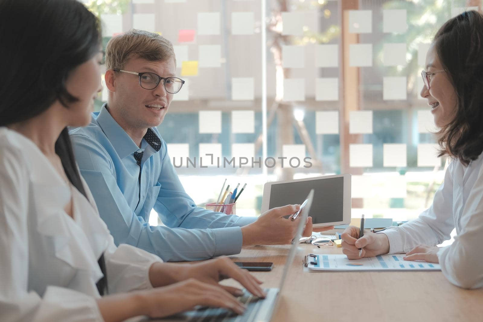 business people discussing on performance revenue in meeting. businessman working with co-worker team. financial adviser analyzing data with investor.