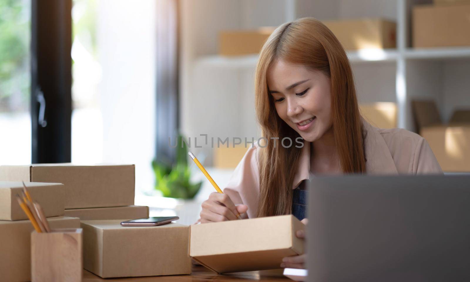 Startup successful small business owner sme beauty girl stand with tablet smartphone in coffee shop restaurant. Portrait of asian tan woman barista cafe owner. SME entrepreneur seller business concept.