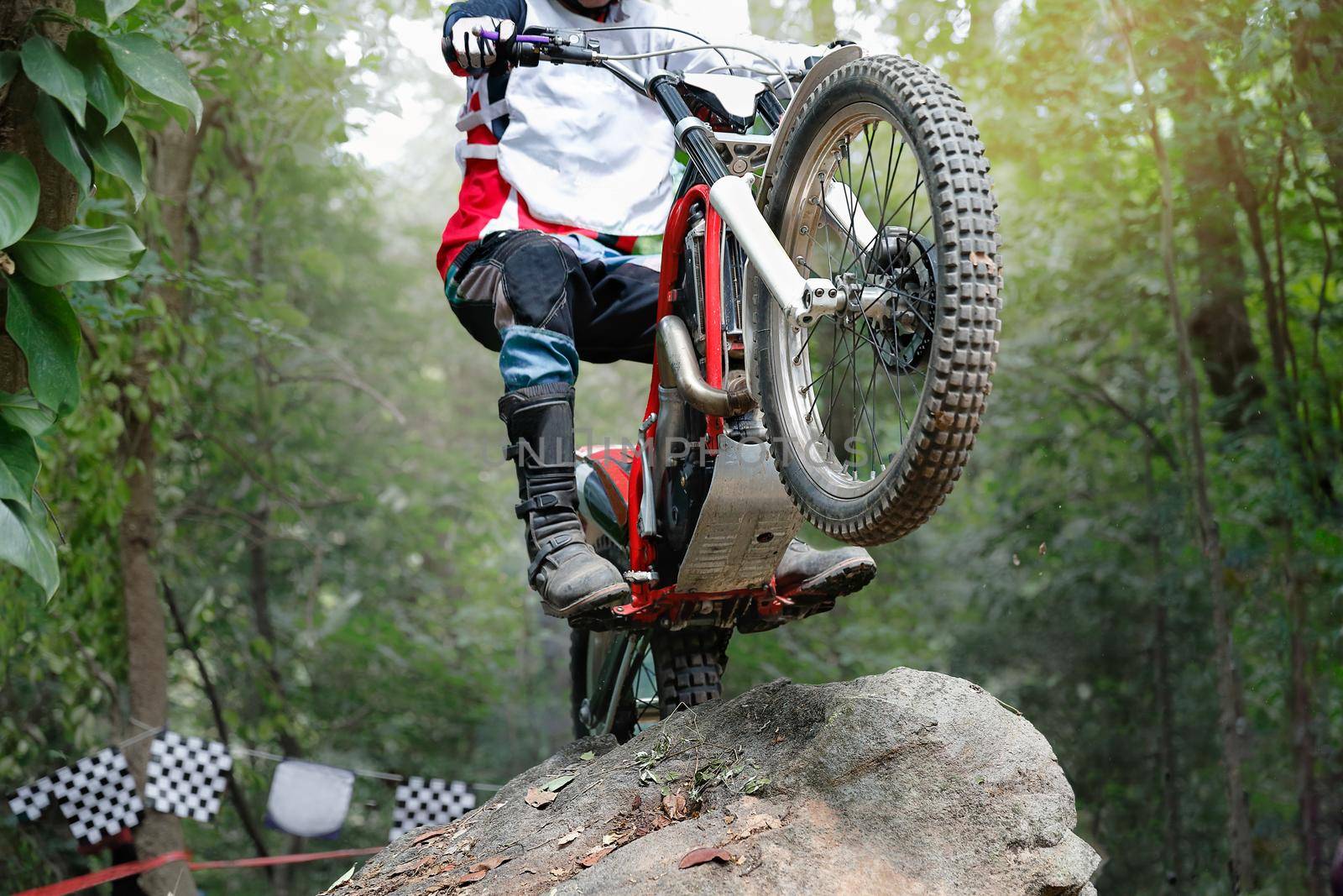 Trials motorcycle is jumping over rocks by toa55