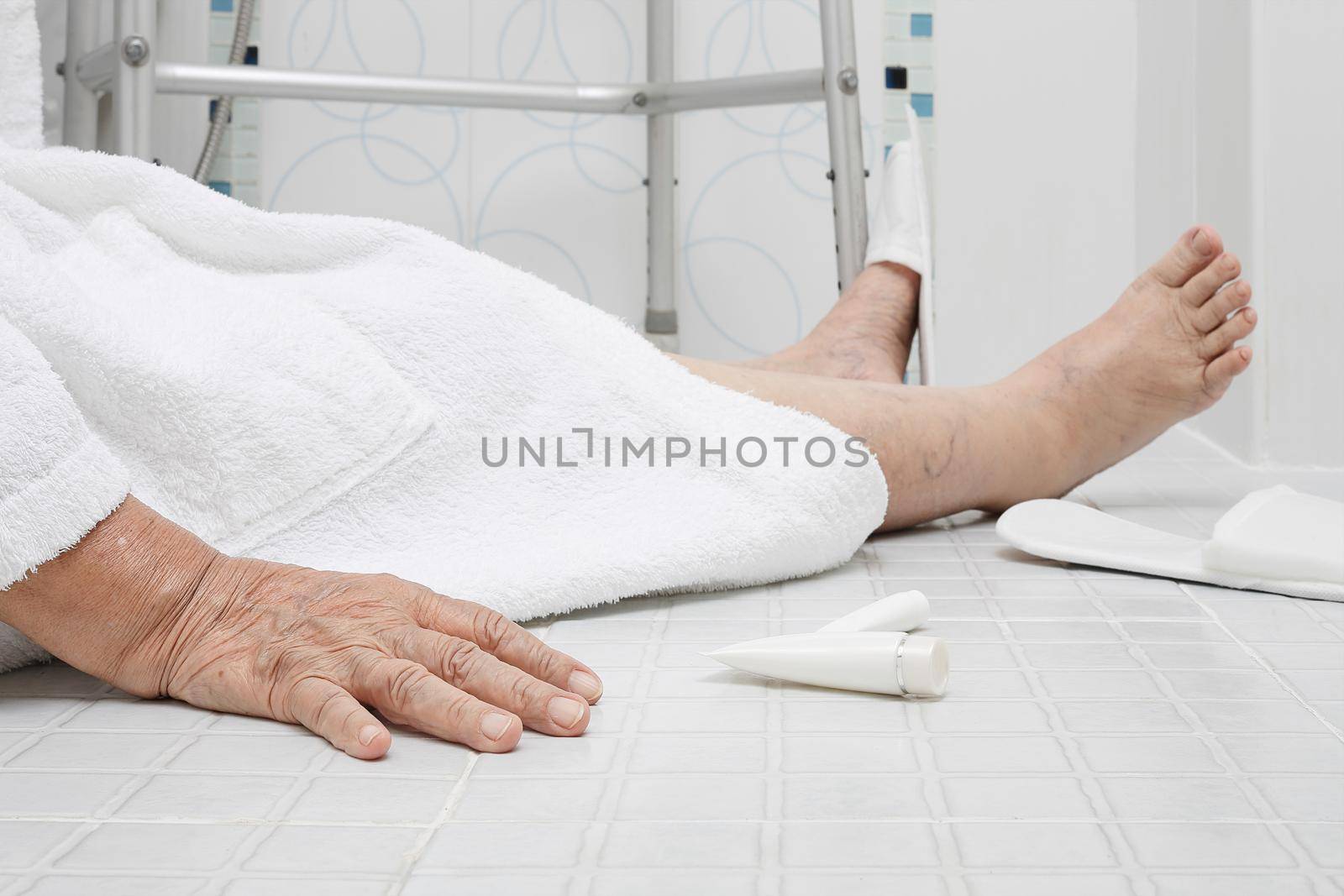 Elderly woman falling in bathroom because slippery surfaces