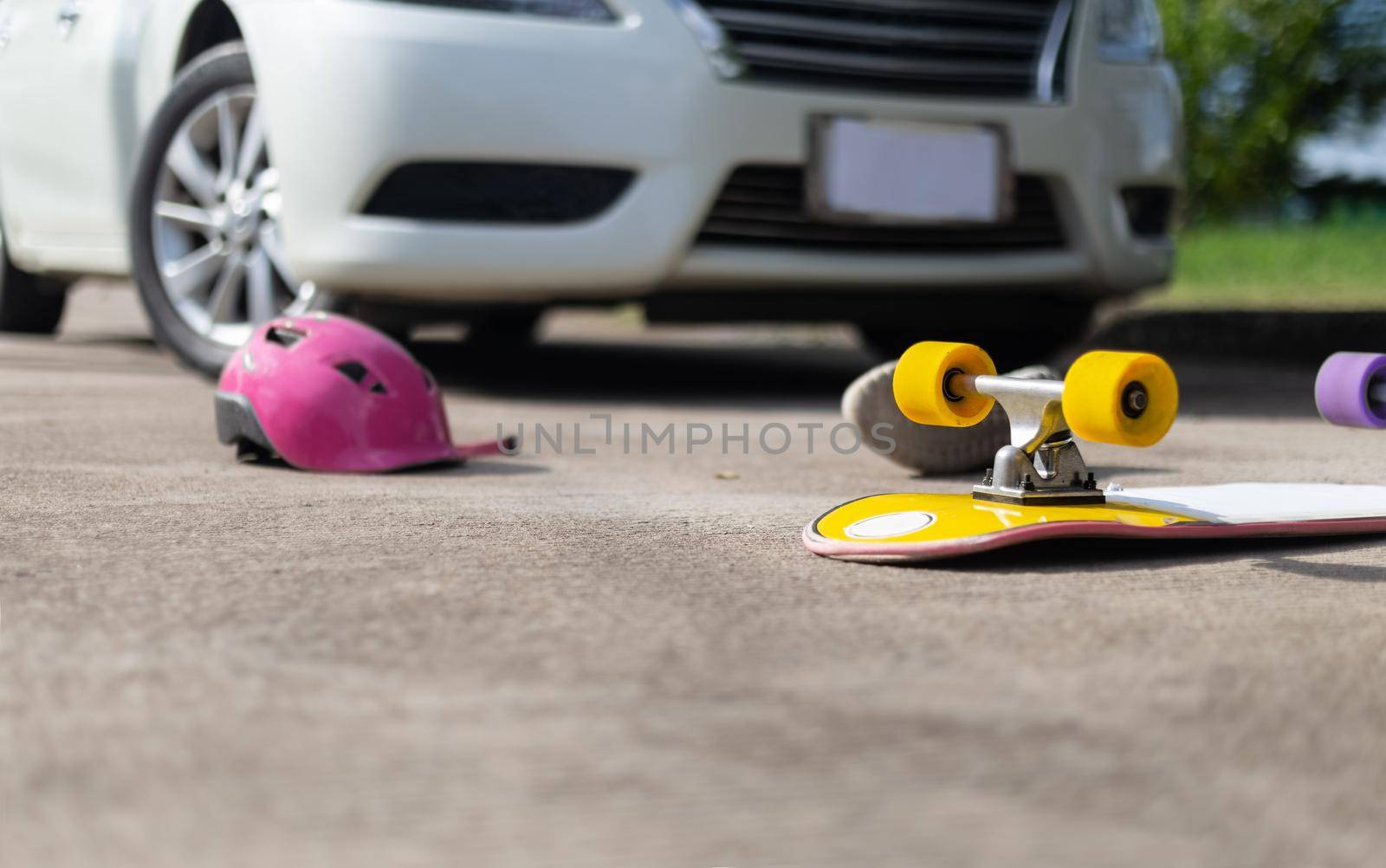 Accident skateboard crashes car after stunt on street and lost control.
