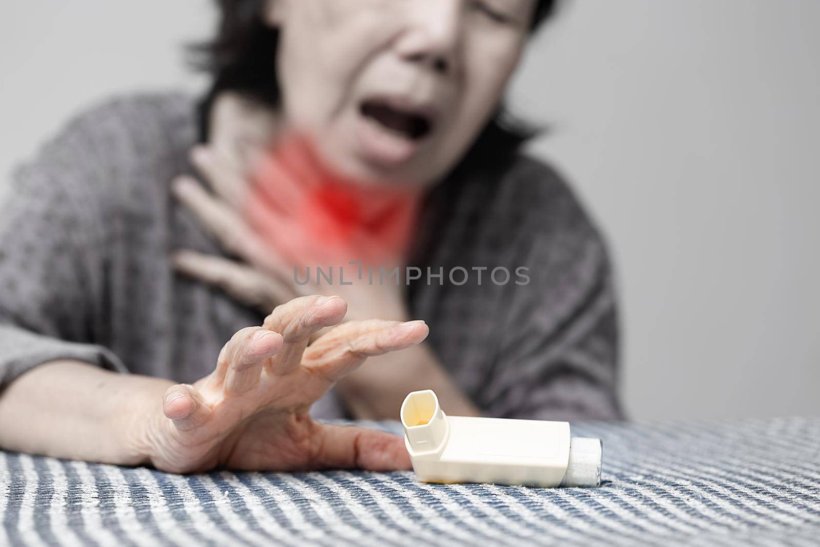 Elderly woman choking and holding an asthma spray by toa55