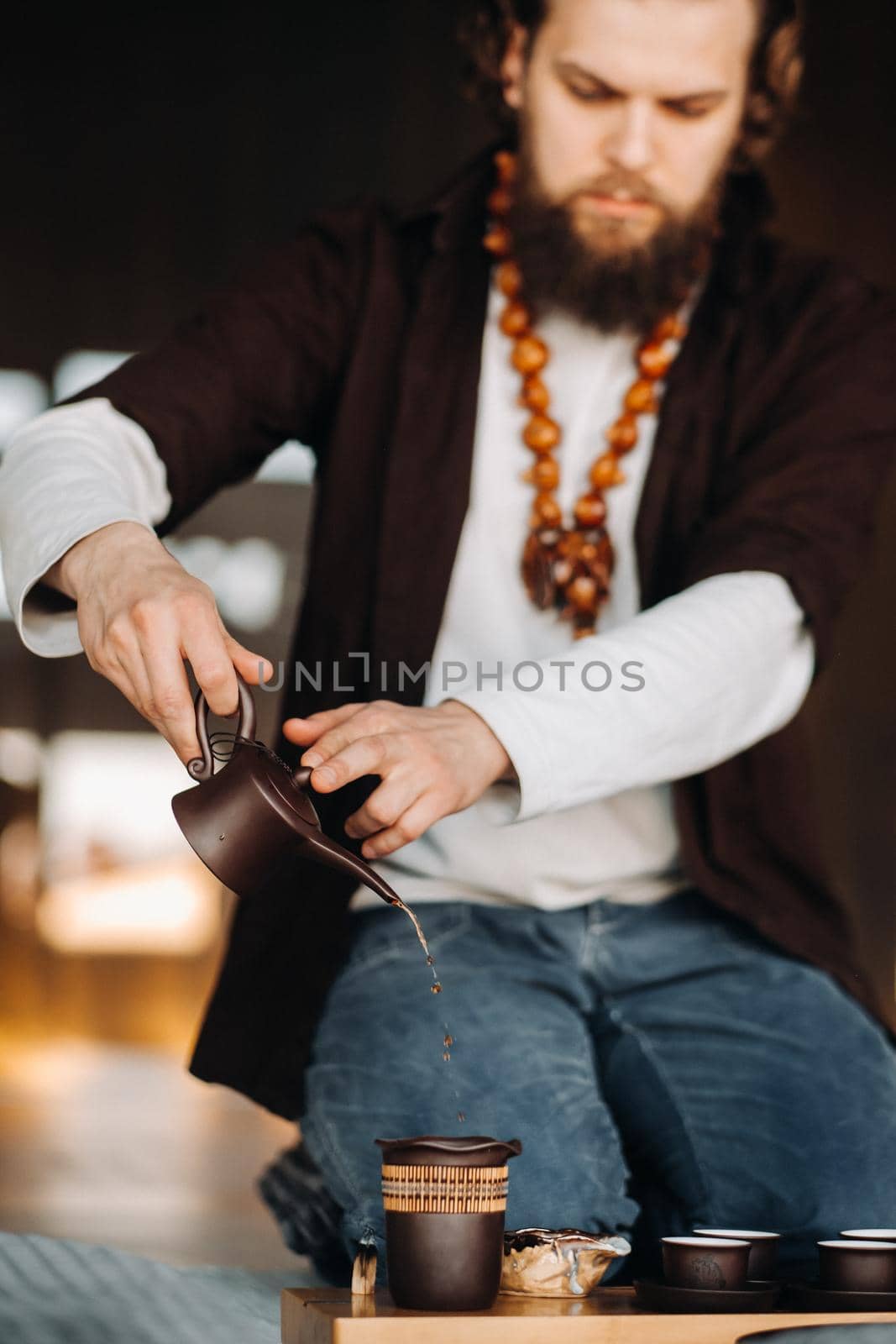 The tea master is preparing to hold a tea ceremony in the interior.