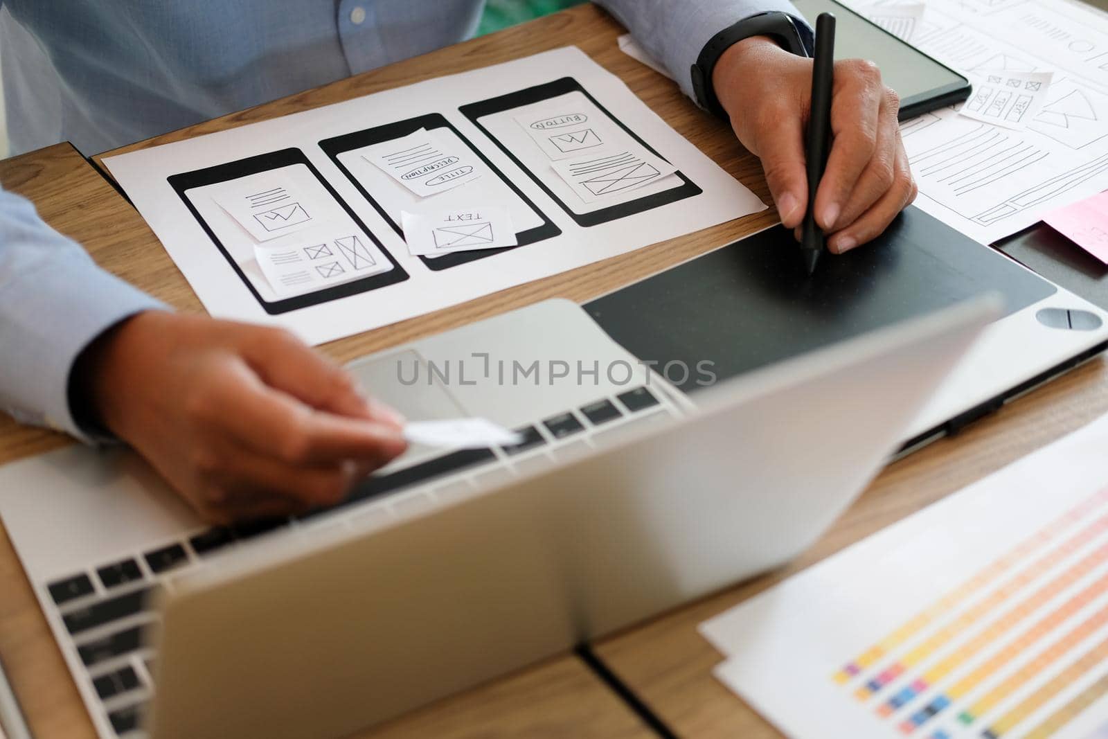 user experience UX designer designing web on smart phone layout. UI planning mobile application. developer work with business prototype