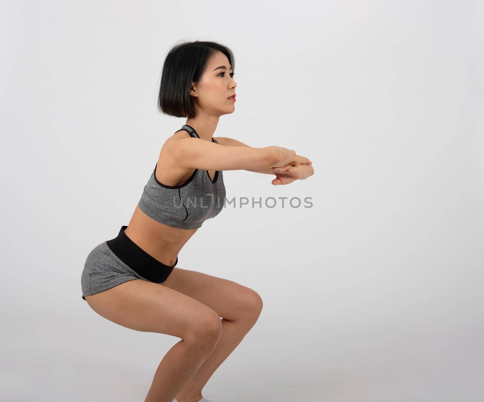 sporty fitness woman in sportswear on white background. healthy sport lifestyle