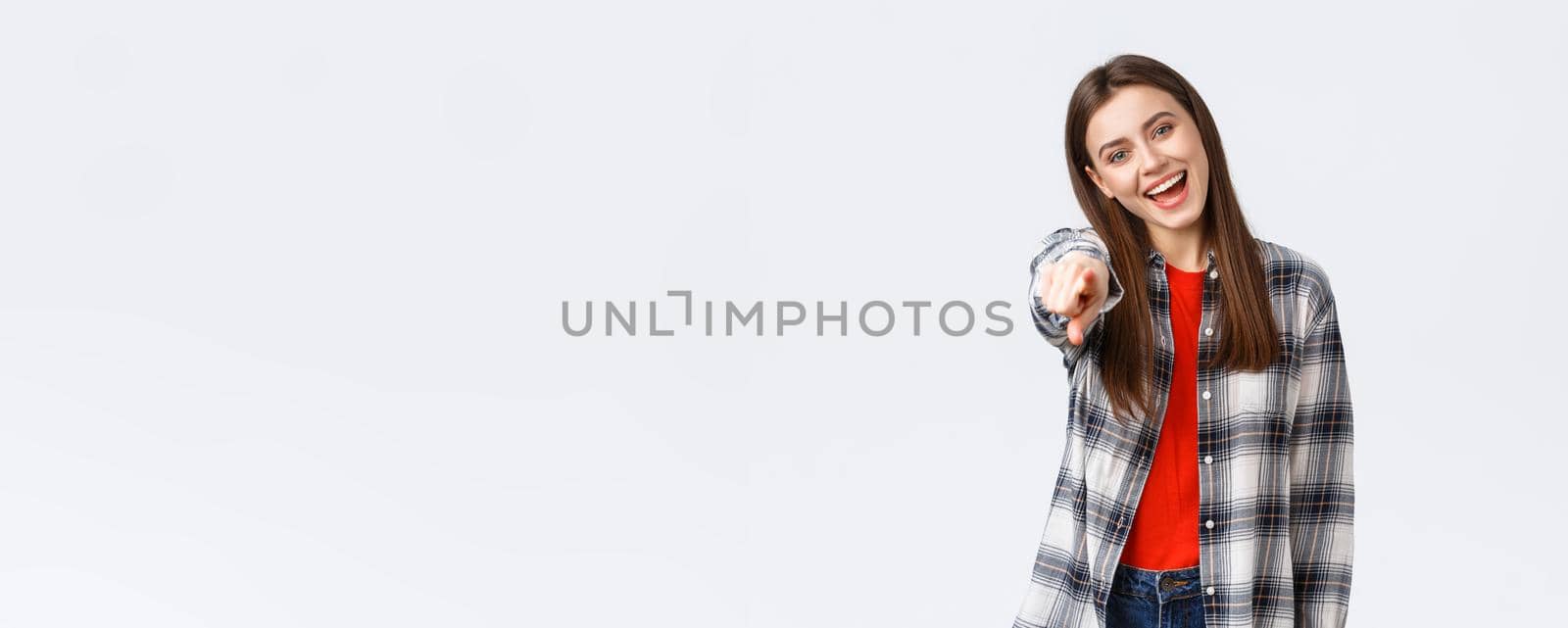 Lifestyle, different emotions, leisure activities concept. Carefree friendly happy girl pointing at camera, picking you, congratulating. HR female employee found perfect job, smiling enthusiastic by Benzoix