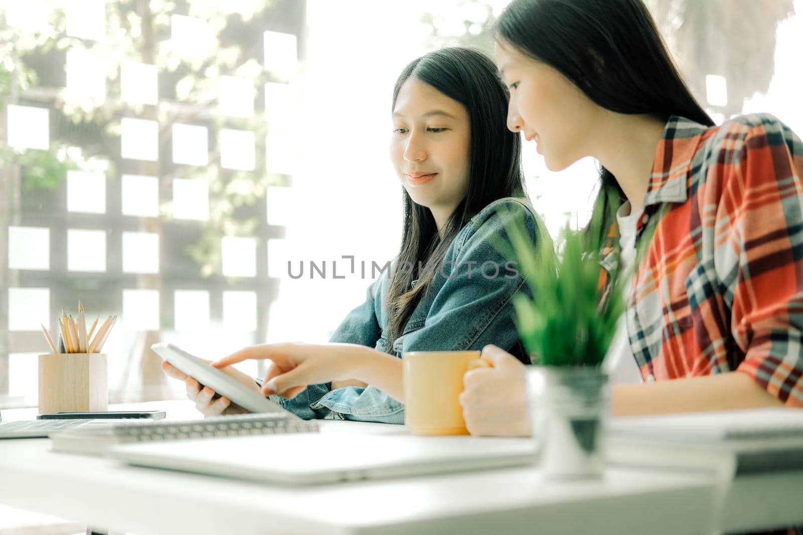 girl teenager college high school student studying with tablet computer laptop