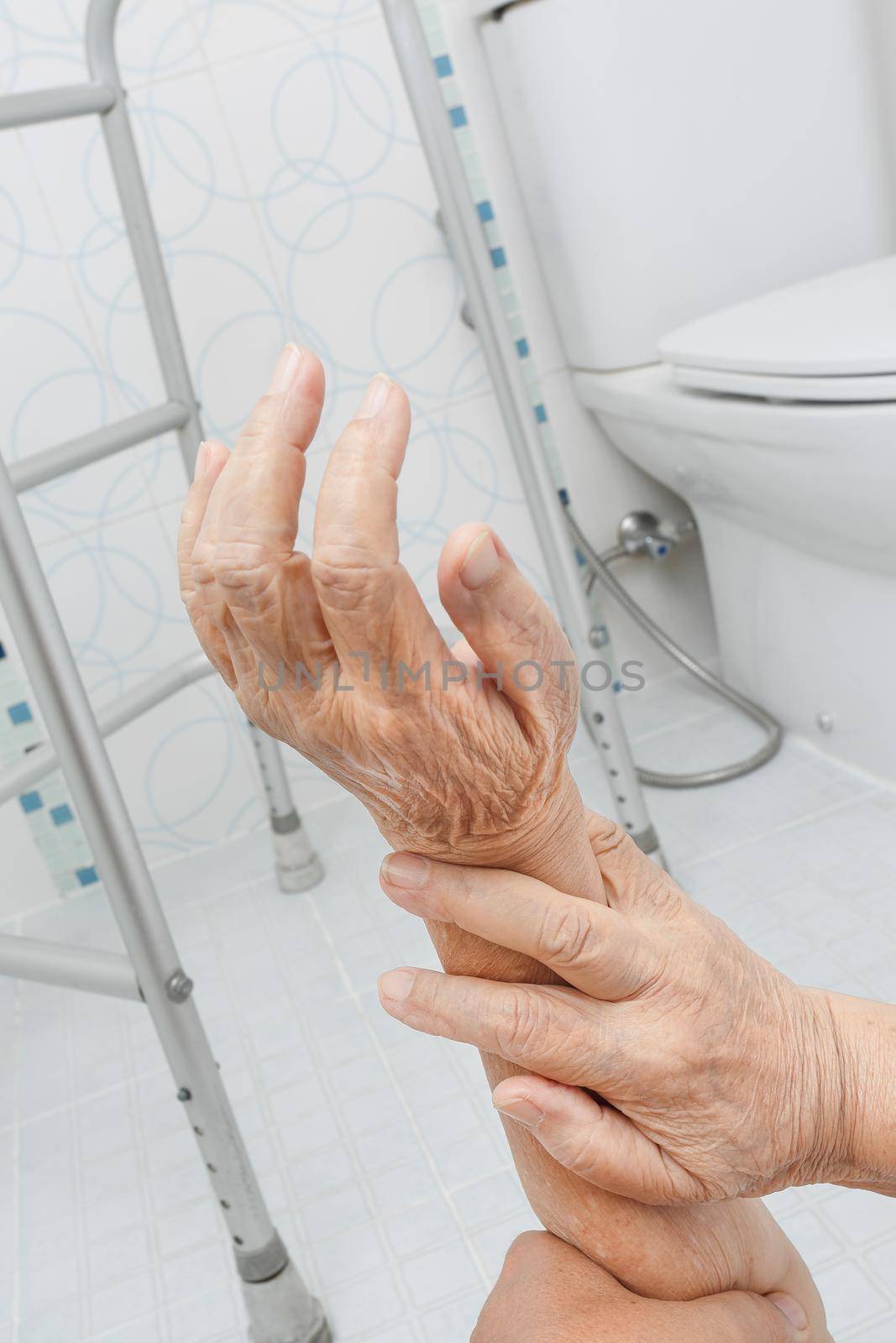 Elderly woman falling in bathroom because slippery surfaces