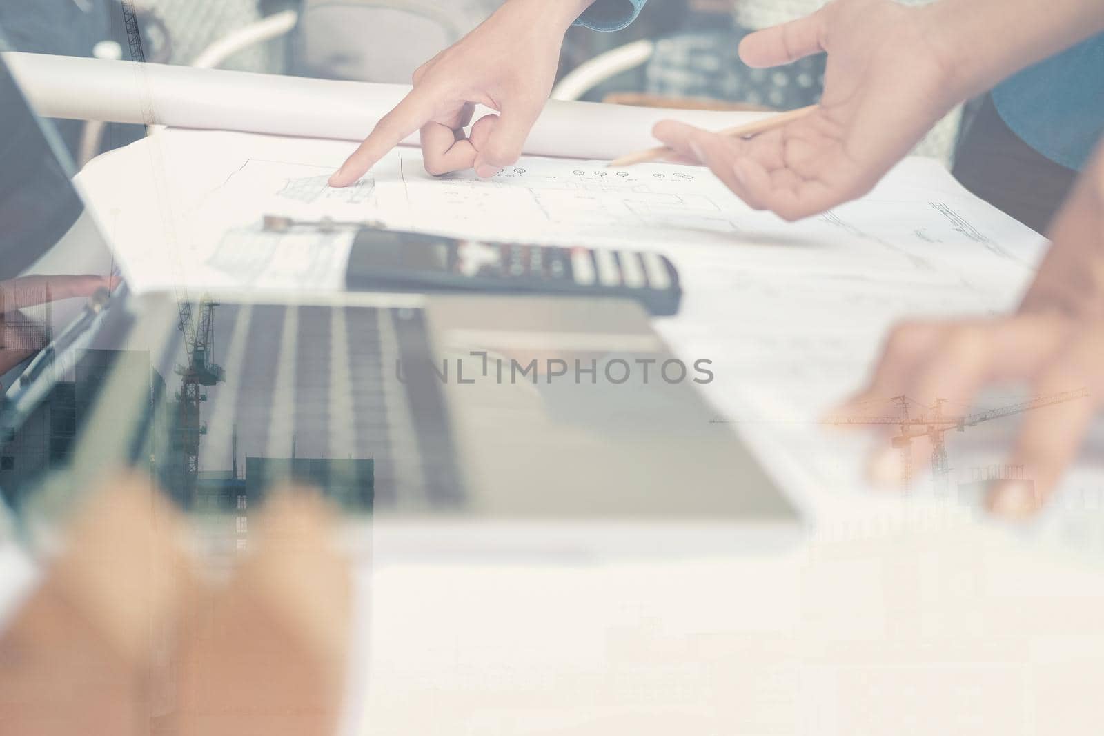 architect engineer working on house blueprint of real estate project at workplace. building construction concept