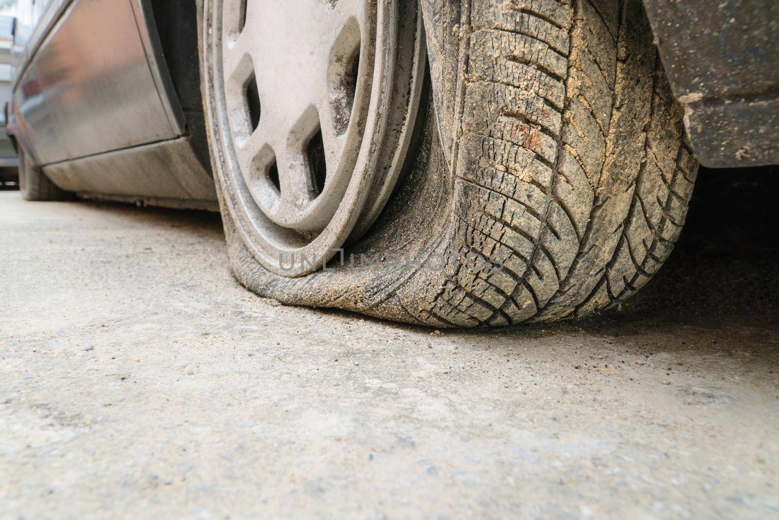 burst tire car on road