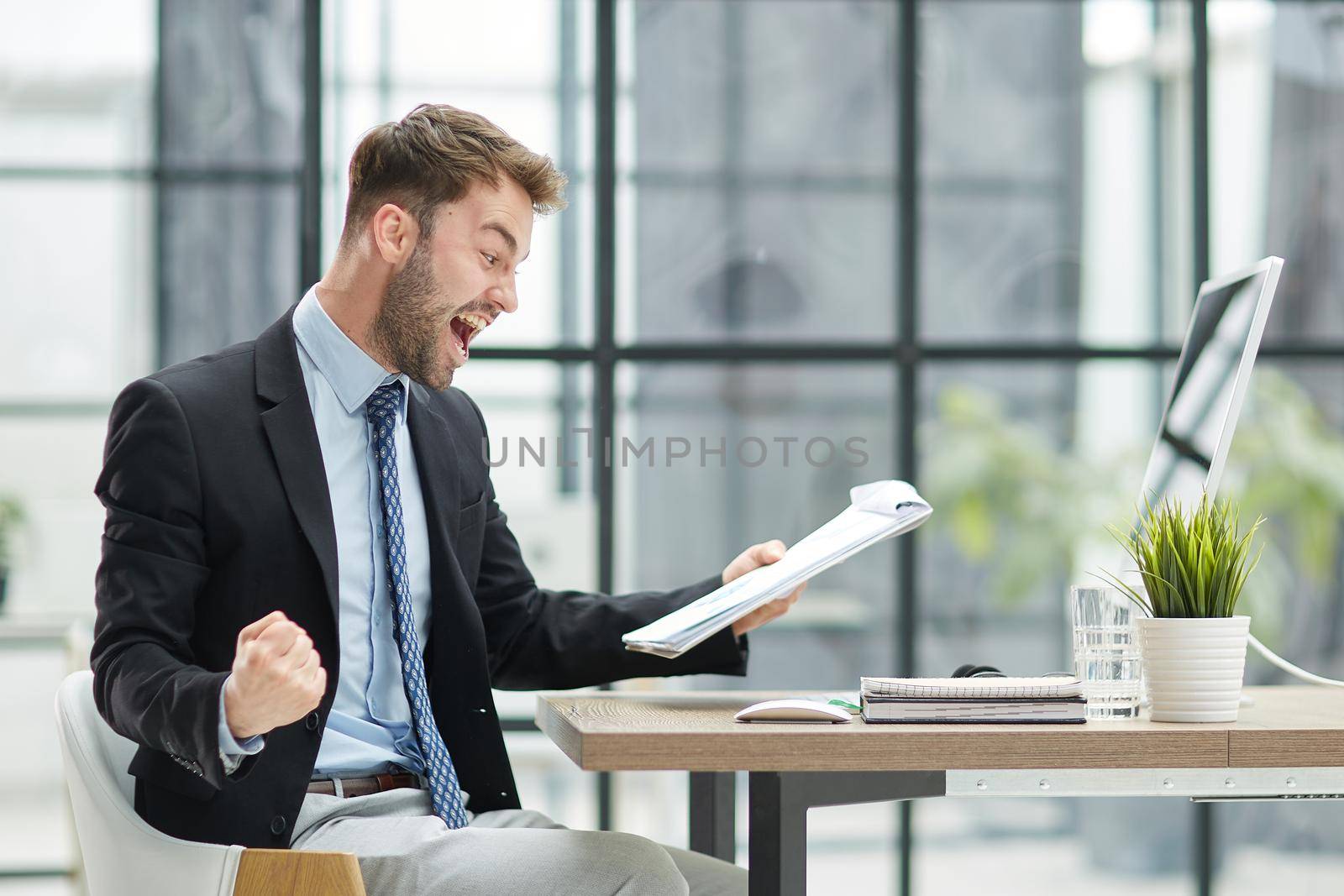 funny male employee have fun perform winner in modern office by Prosto