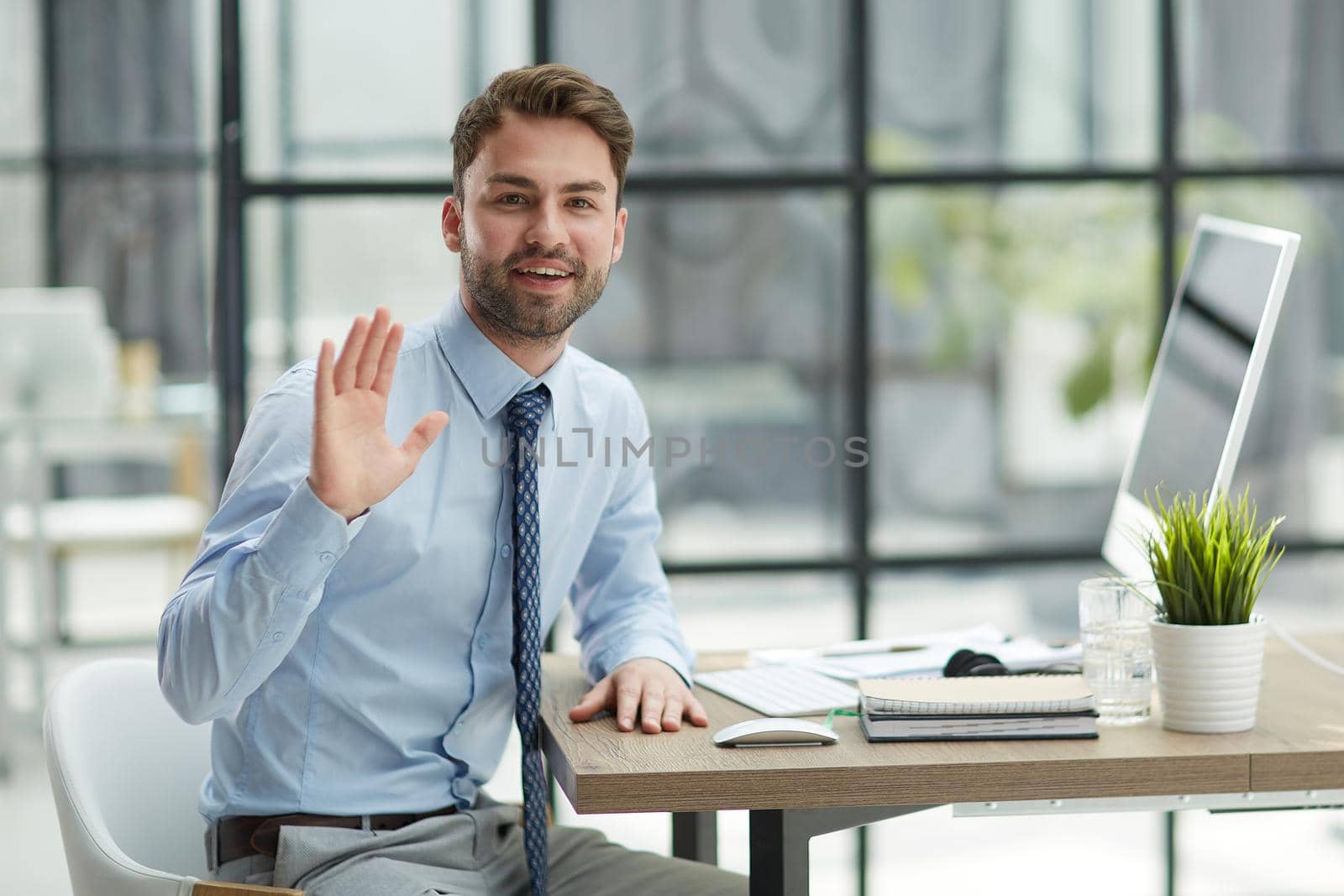 Hello. Portrait Of Cheerful Middle Aged Business Man Waving Hand Smiling