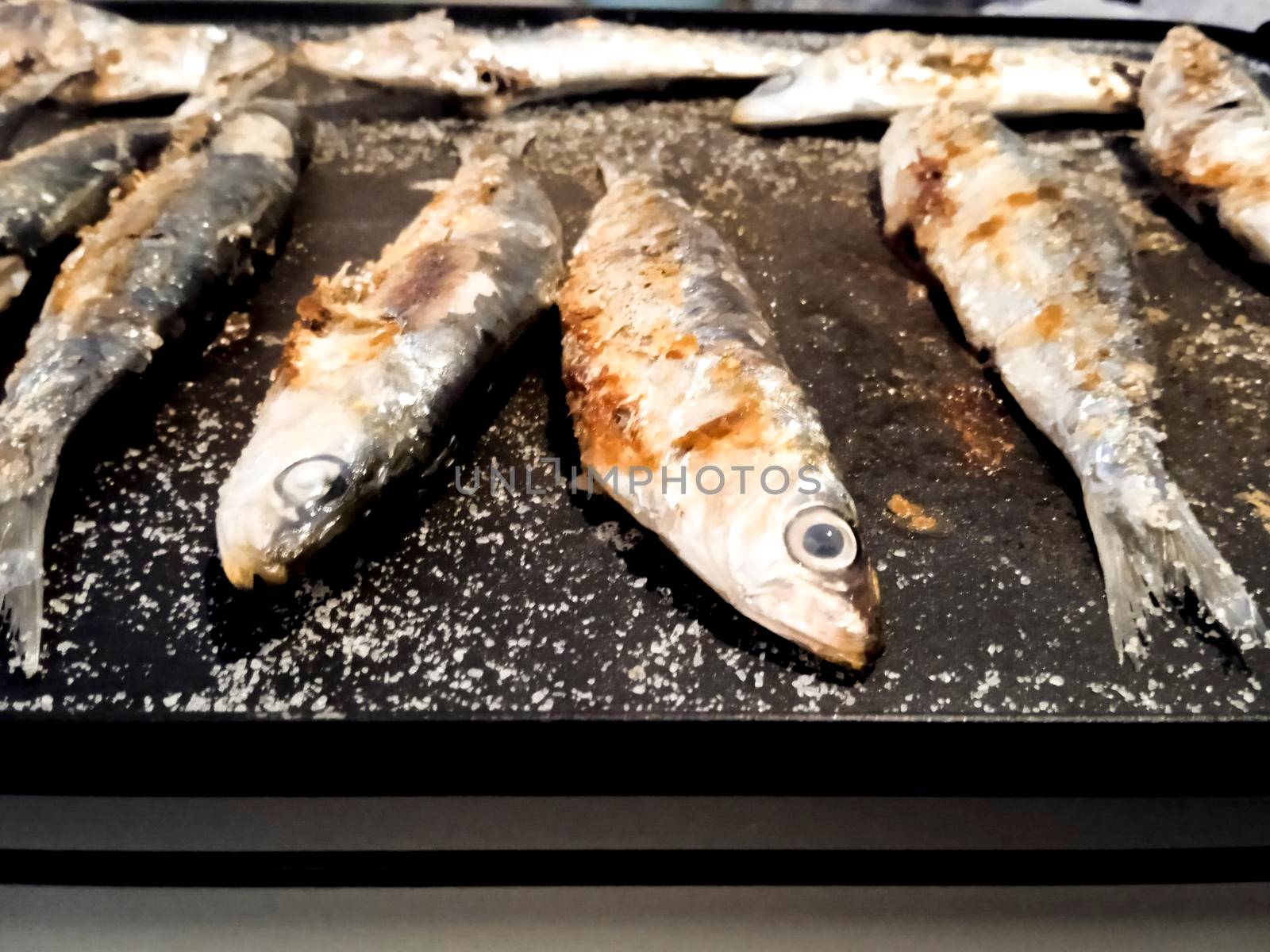 Roasted sardines outdoors in Spain in summer