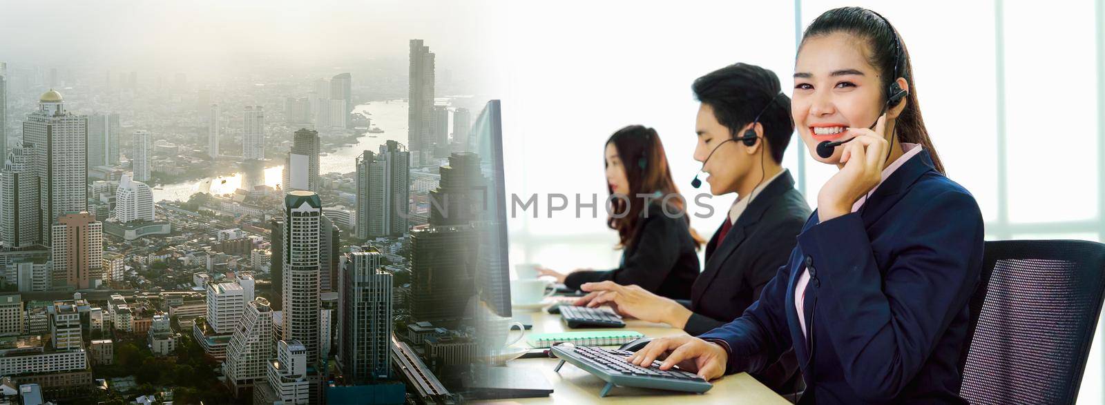 Business people wearing headset working in office in widen view by biancoblue