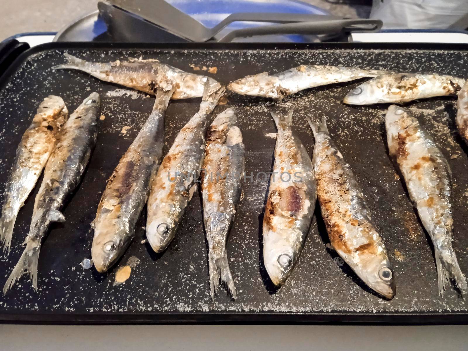 Roasted sardines outdoors in Spain in summer