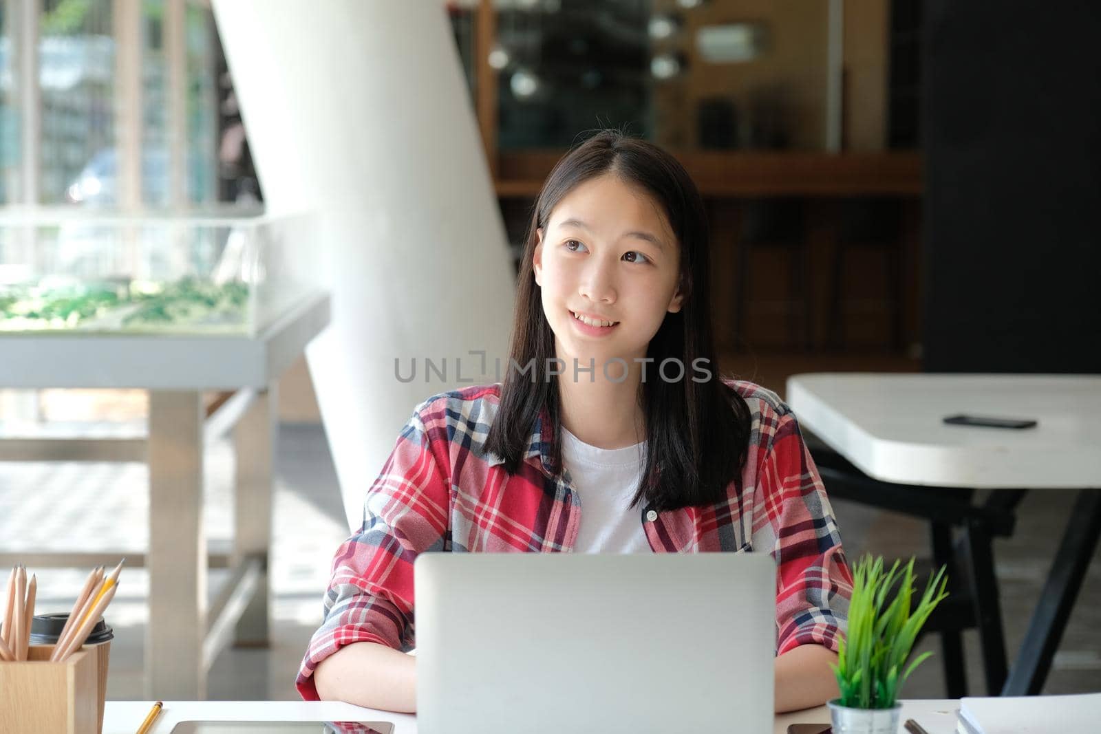 girl teenager college high school student studying with computer laptop