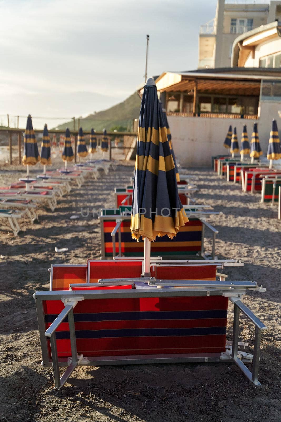 Empty sun beds on the beach during a pandemic coronavirus. Deserted beach in Durres, Albania by driver-s