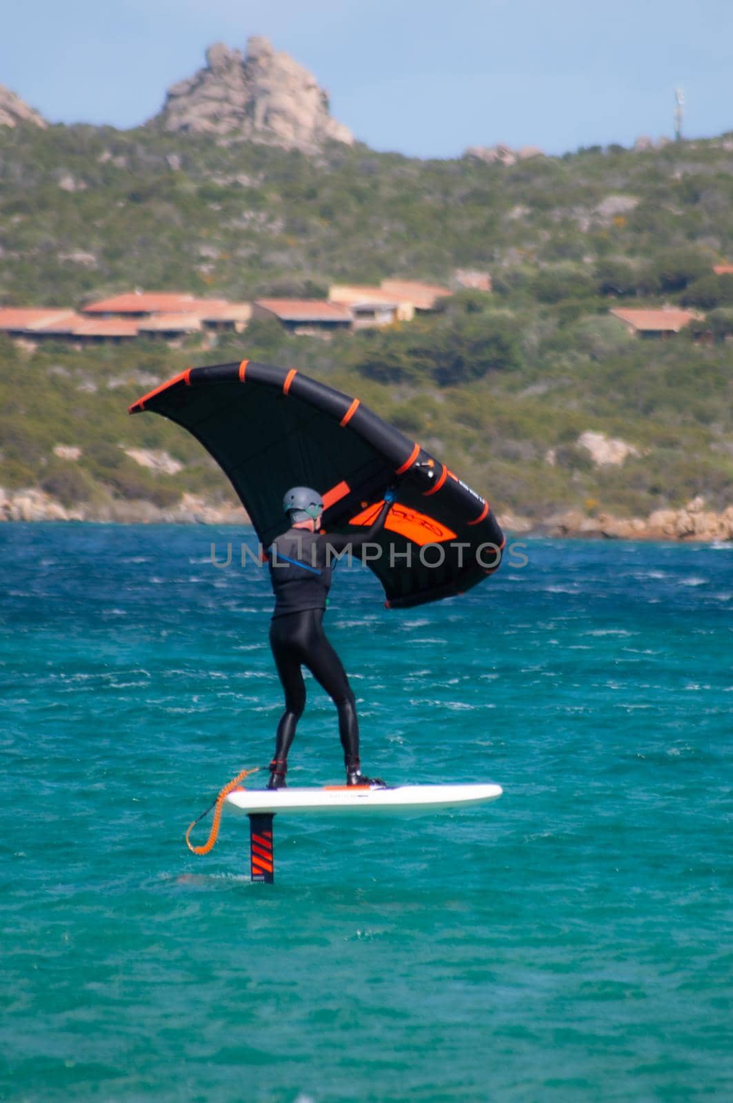 PORTO POLLO - ITALY - APRIL 24, 2020: Wing Foil activities on the SEA FROT MADDALENA ISLAND PORTO POLLO